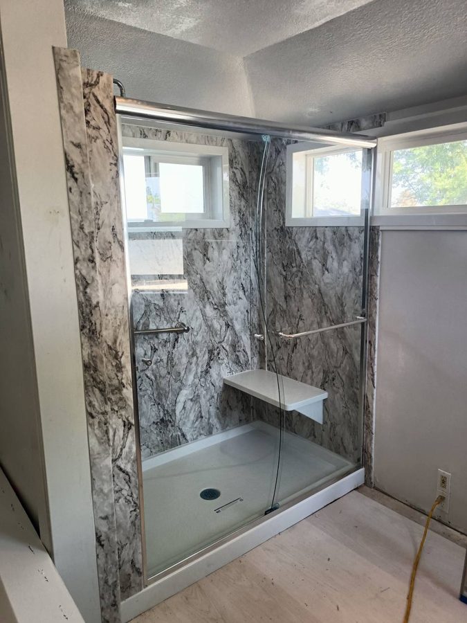 Completed shower with glass slider and bench